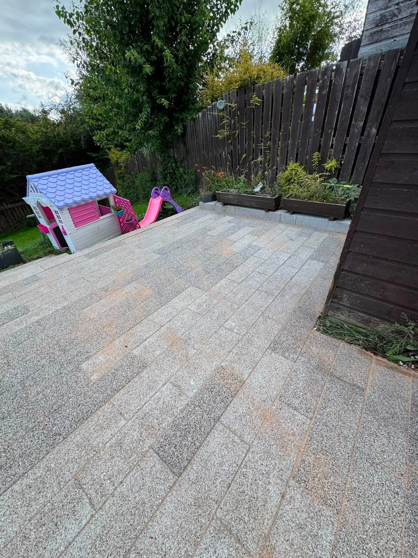 The same patio after pressure cleaning, treatment and re-sanding